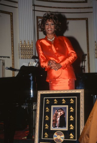 Whitney Houston Receives Plaque during the 1997 Clive Davis Pre Grammy Party.