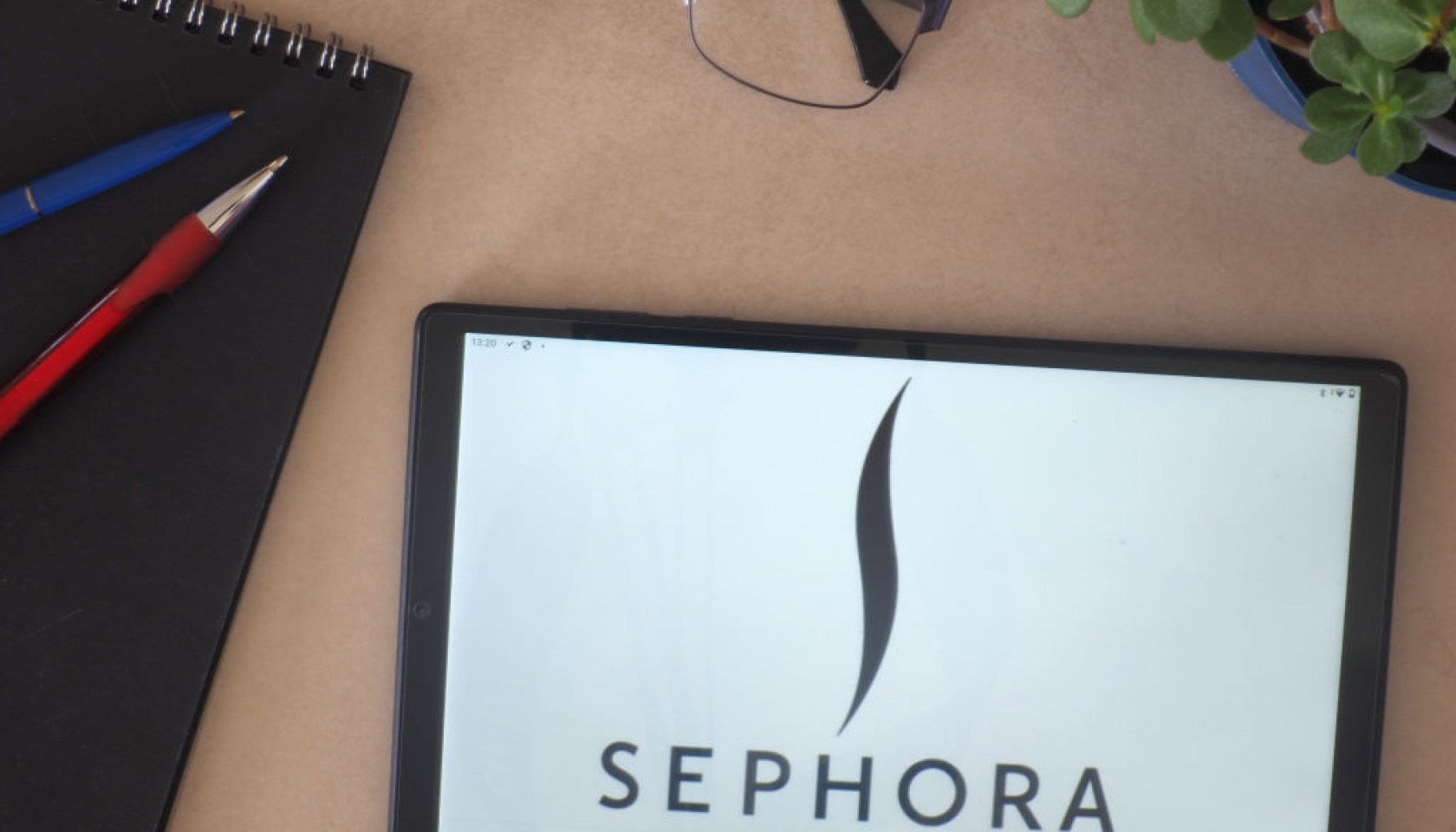In this photo illustration, Sephora logo seen displayed on a...