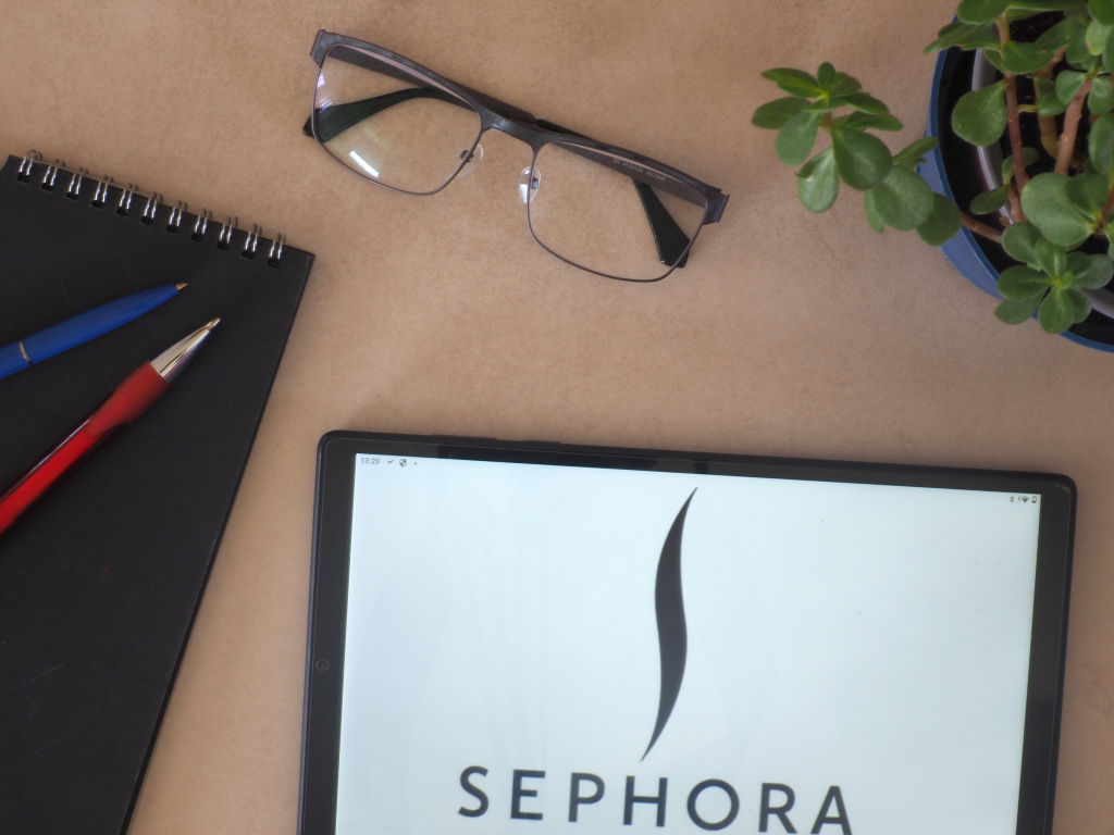 In this photo illustration, Sephora logo seen displayed on a...