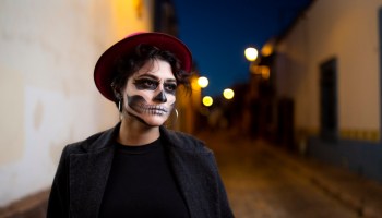 Woman in skull makeup on the street