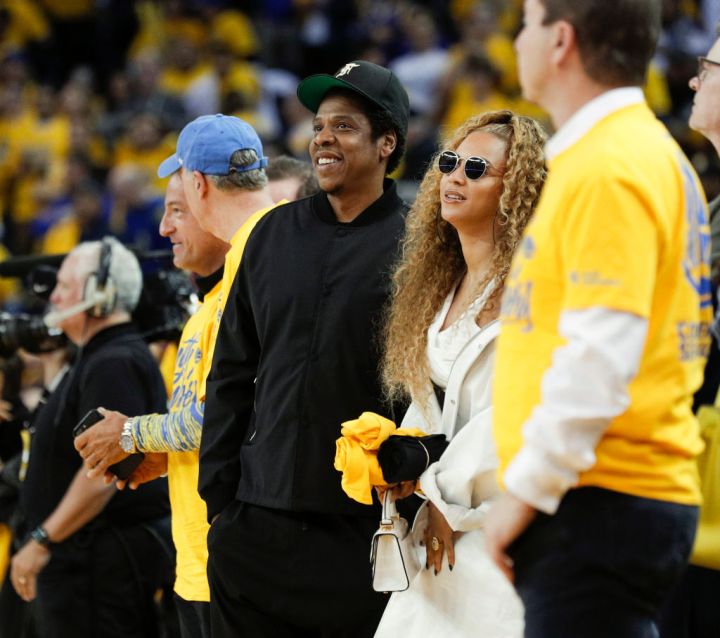 Jay-Z and Beyonce look on in the fourth quarter during game 1 of round 2 of the Western Conference Finals between the Golden State Warriors and the New Orleans Pelicans at Oracle Arena on Saturday, April 28, 2018 in Oakland, Calif