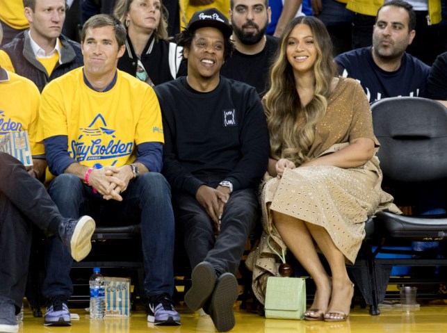 Beyonce Knowles and Jay-Z sit courtside as the Golden State Warriors and Toronto Raptors face off in Game 3 of the NBA Finals at Oracle Arena in Oakland, Calif. Wednesday, June 5, 2019.