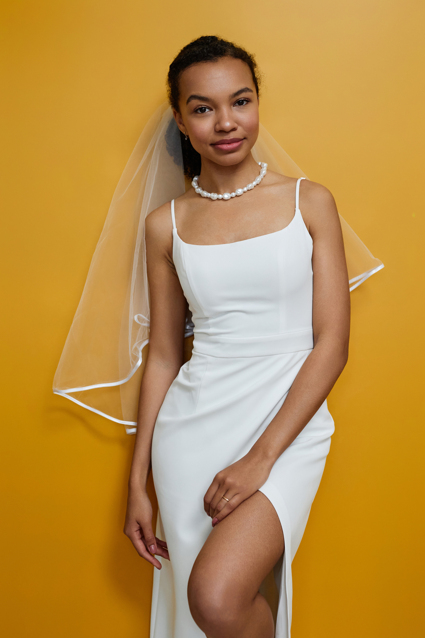 Vertical portrait of elegant black young woman wearing wedding dress - bridal makeup
