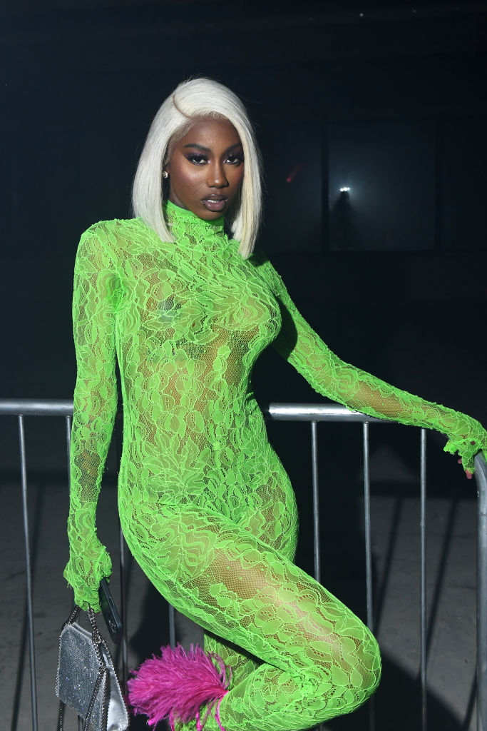 Flo Milli's Lacy Green Jumpsuit And Blonde Hair Entered The NYFW Chat.