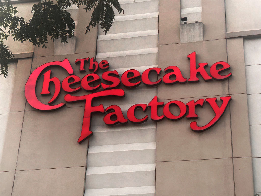The Cheesecake Factory logo and sign outside shopping Mall, Queens, New York