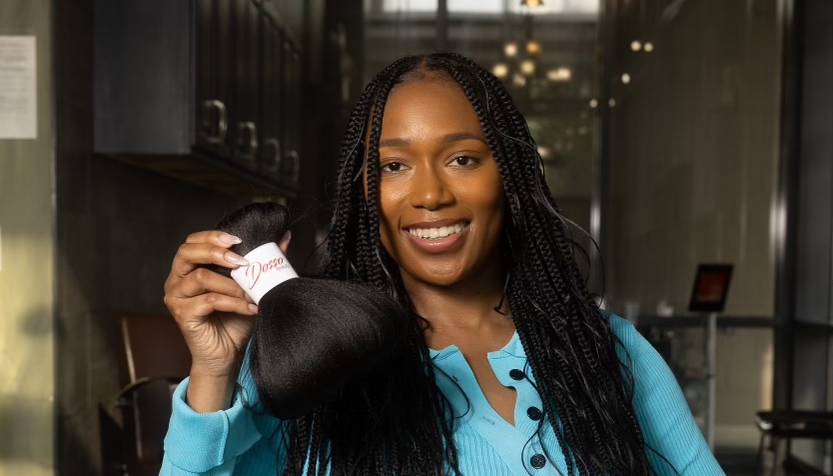 Kadija Dosso holding Dosso Beauty's Pre-Stretched Hypoallergenic Braiding Hair