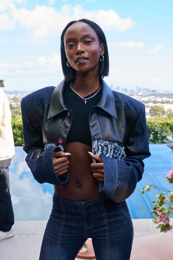 It's Ebony's world - everyone else is just drinking tea in it.