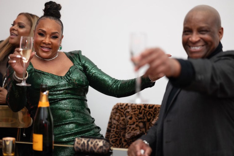 Vivica Fox rocks money green.