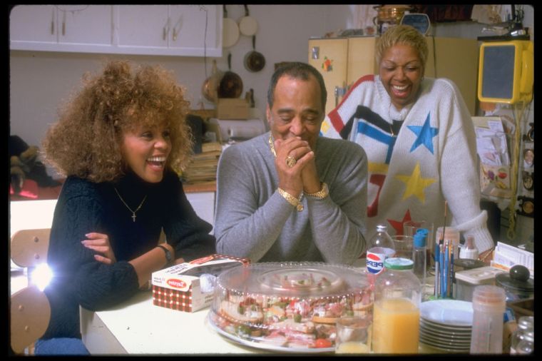 Whitney Houston and her family enjoy a laugh at home.