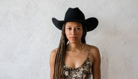 Woman in Black cowboy hat