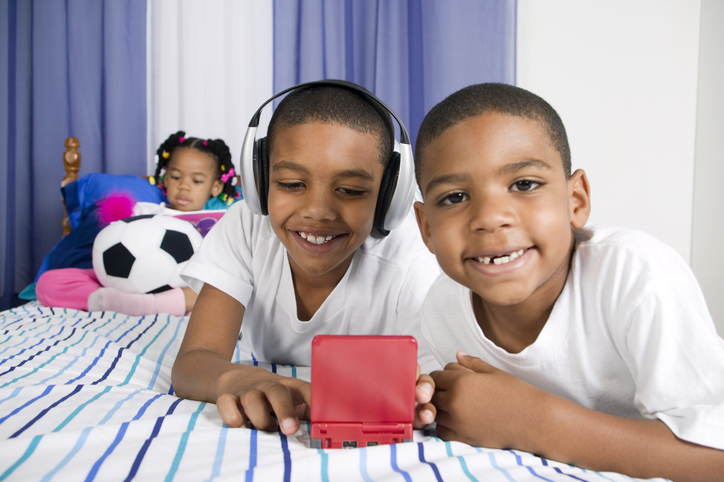 Two boys and a girl playing