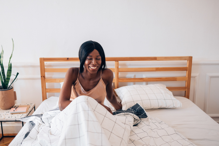 Rise and Shine! Black woman waking up in the morning