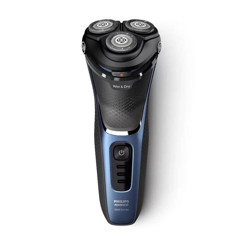 A black and gray electric shaver with three circular shaving heads and a power button. The device is labeled "Philips Norelco 3000 Series".