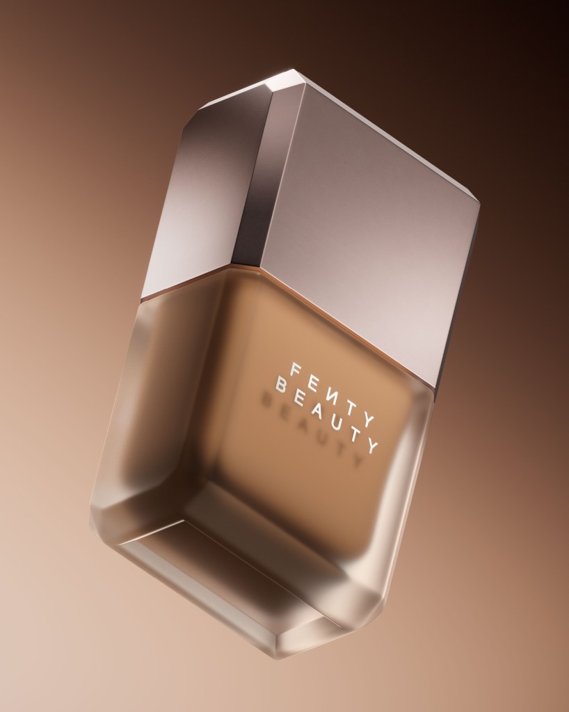 A silver-colored perfume bottle with the text "FENTY BEAUTY" printed on the front.