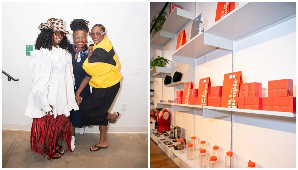 Three women wearing colorful, stylish outfits posing together, with shelves of orange boxes and containers in the background.